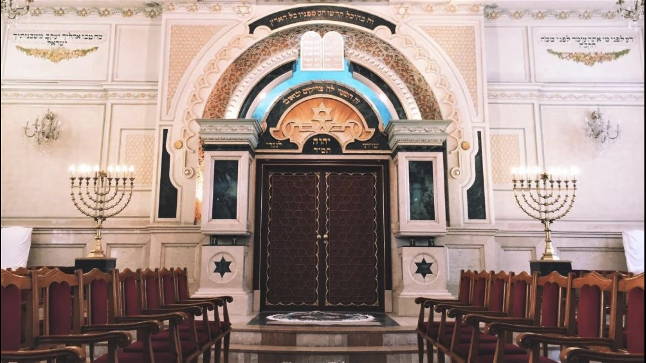 Historic synagogue interior in Morocco — traditional arches and zellige tiling
